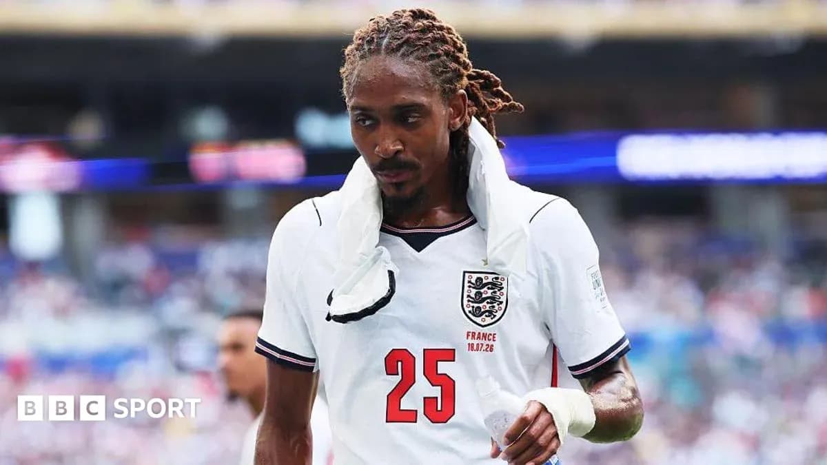 Player in England jersey walking off the field Player in England jersey walking off the field