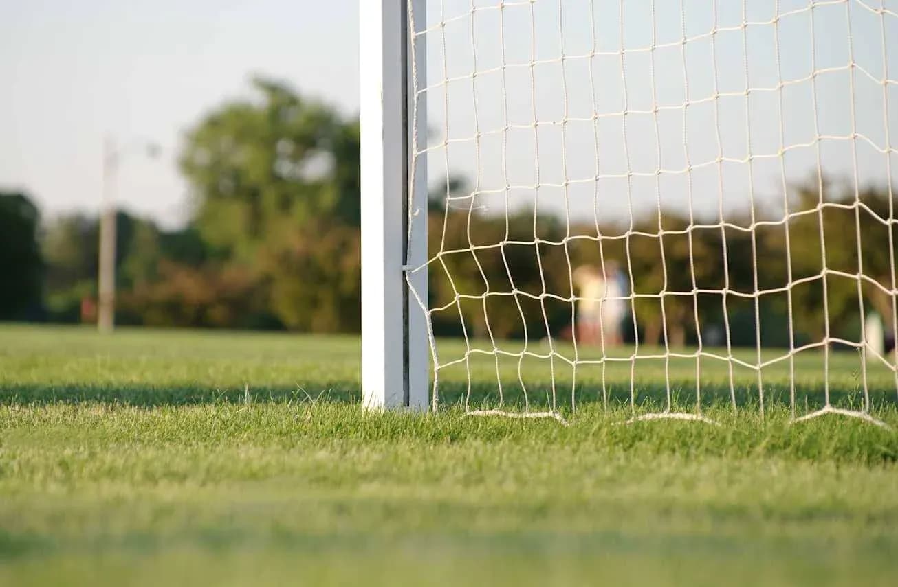 Goal post and net on a soccer field Goal post and net on a soccer field