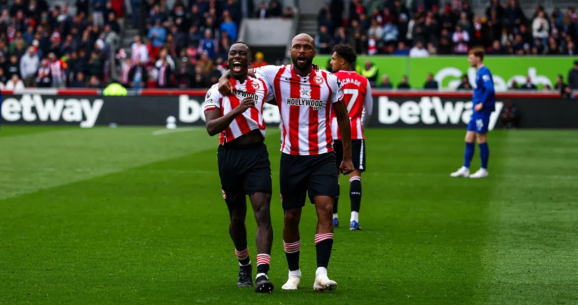 Brentford players celebrating a goal on the pitch Brentford players celebrating a goal on the pitch