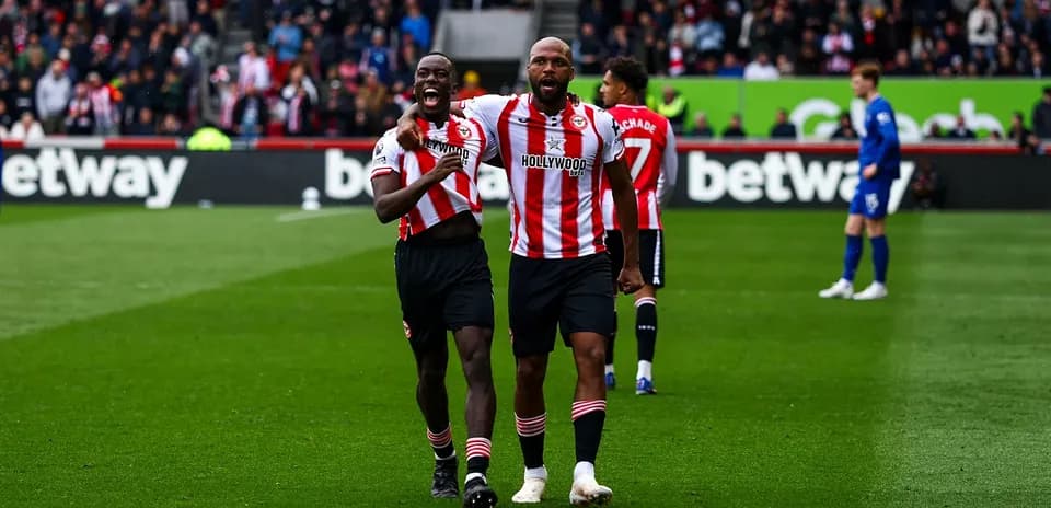 Brentford players celebrating a goal on the pitch Brentford players celebrating a goal on the pitch