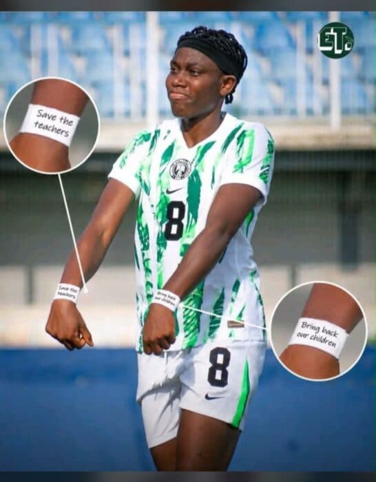 Football player wearing wristbands with messages Football player wearing wristbands with messages