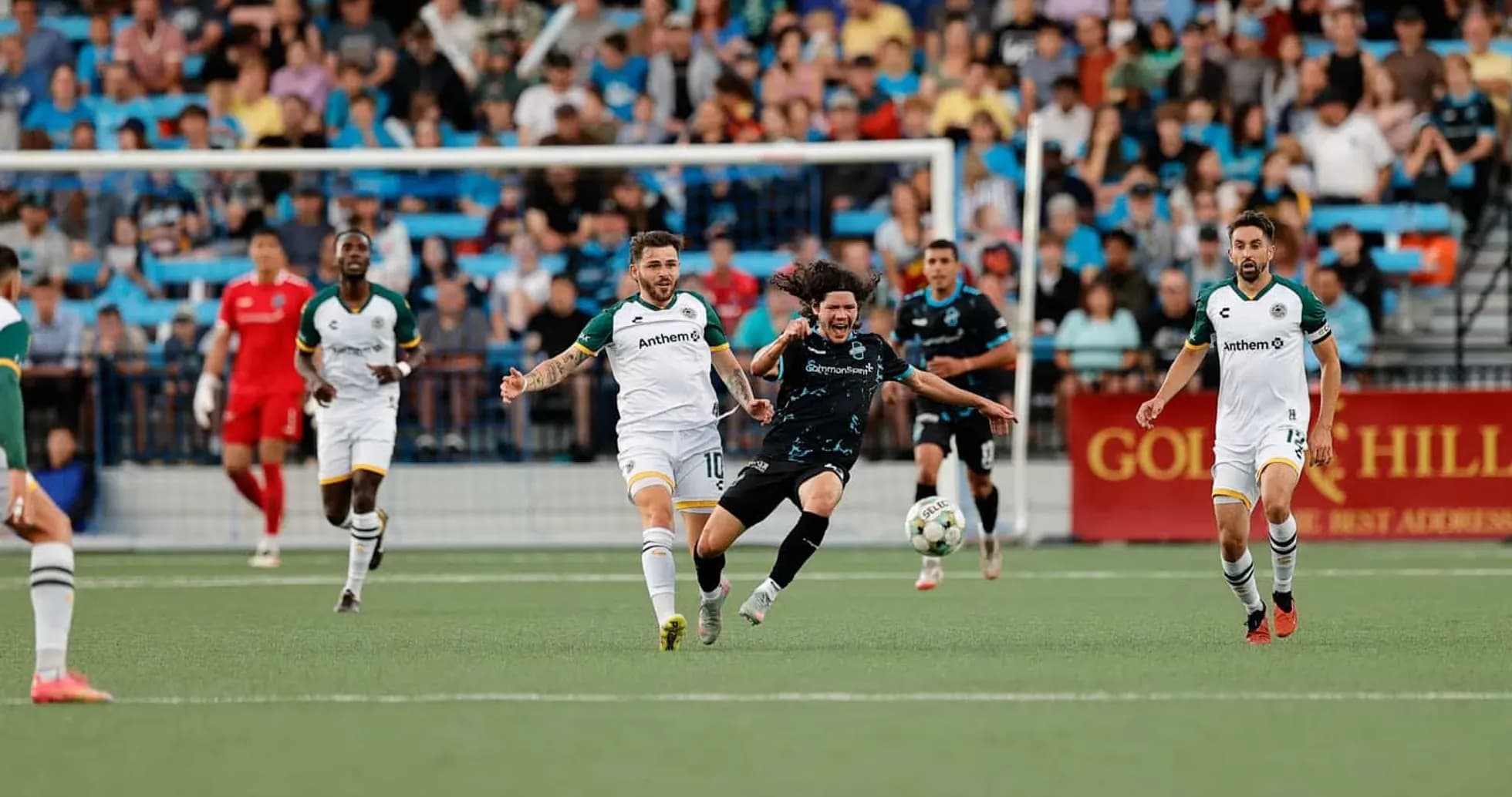 Players competing for the ball during match Players competing for the ball during match
