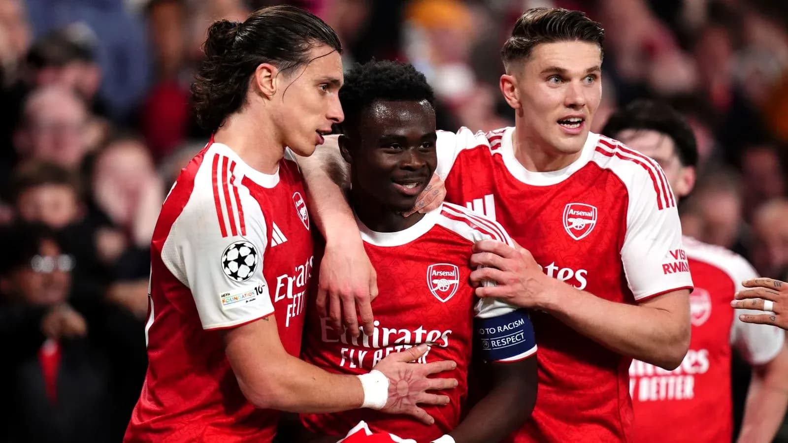 Arsenal players celebrating a goal together Arsenal players celebrating a goal together