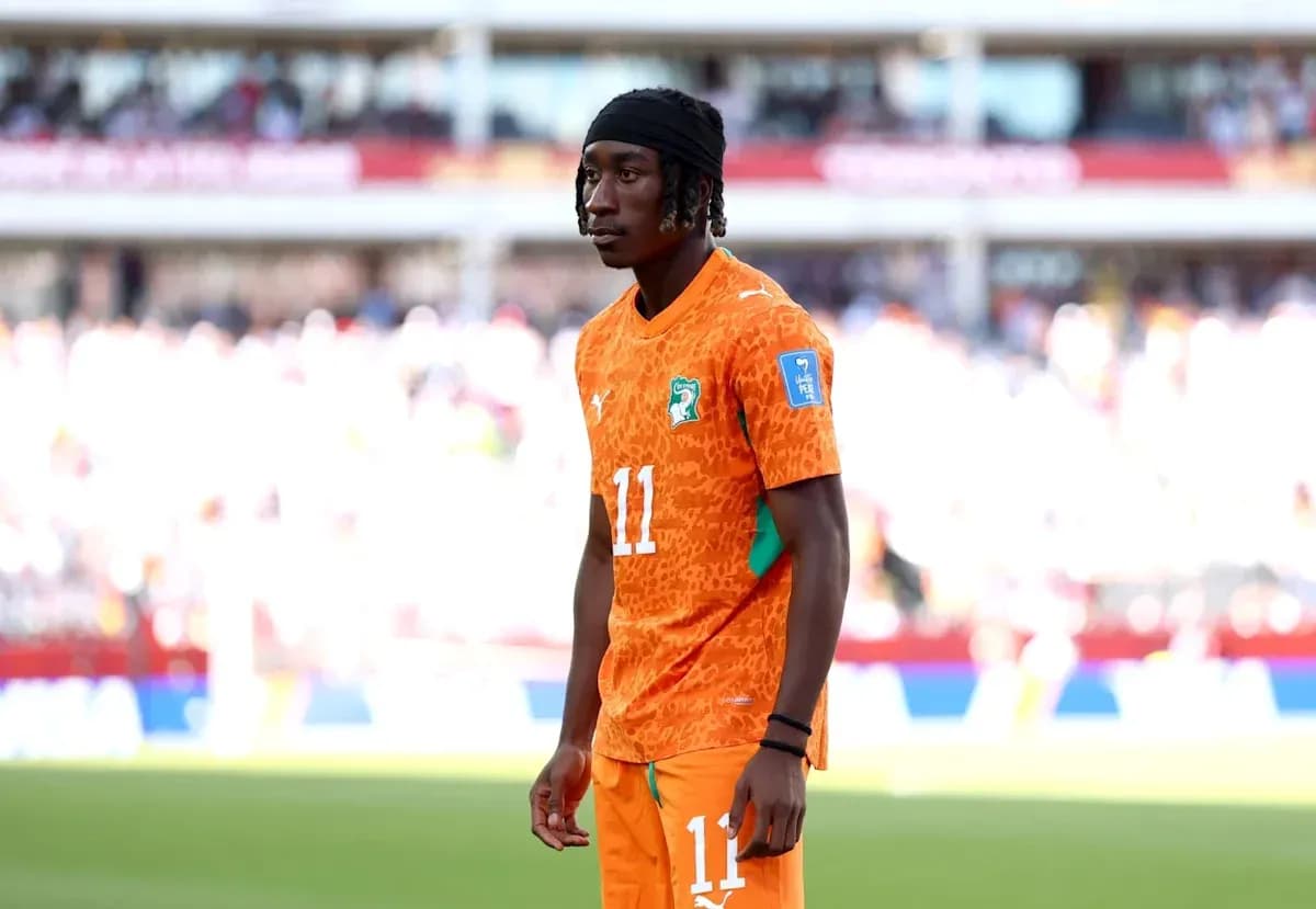 Player in orange jersey standing on the field Player in orange jersey standing on the field