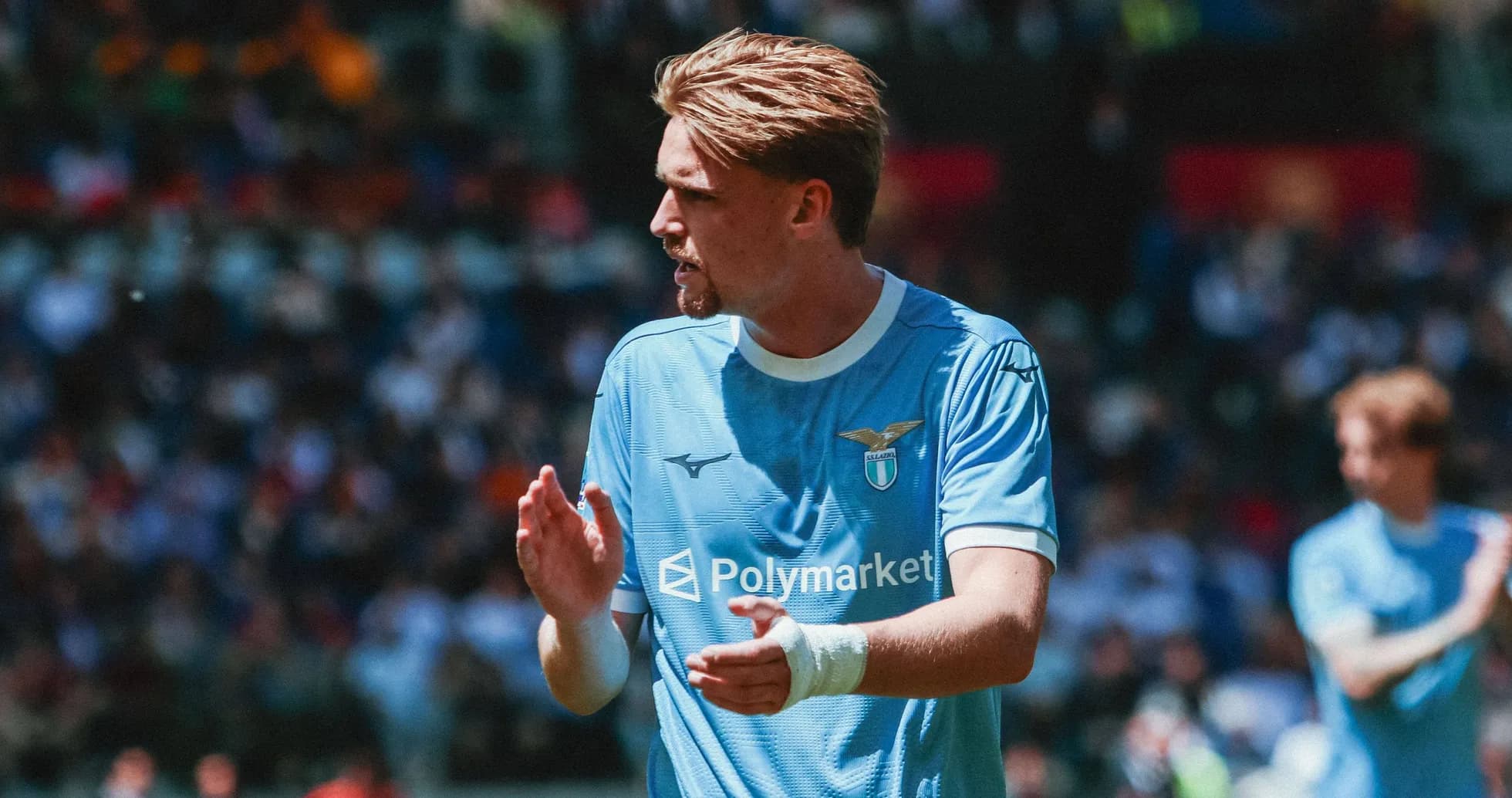 Lazio player applauding during match on the field Lazio player applauding during match on the field