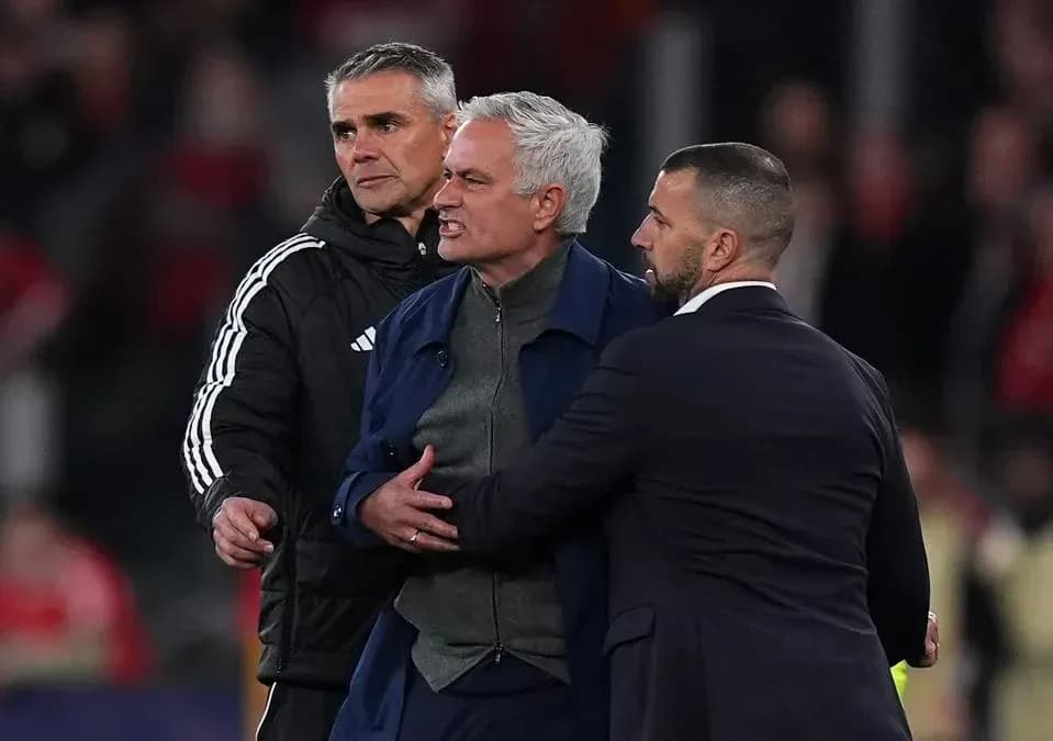 Manager being restrained by staff during confrontation Manager being restrained by staff during confrontation