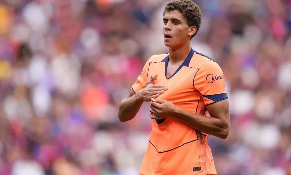 Player in orange jersey during a match Player in orange jersey during a match