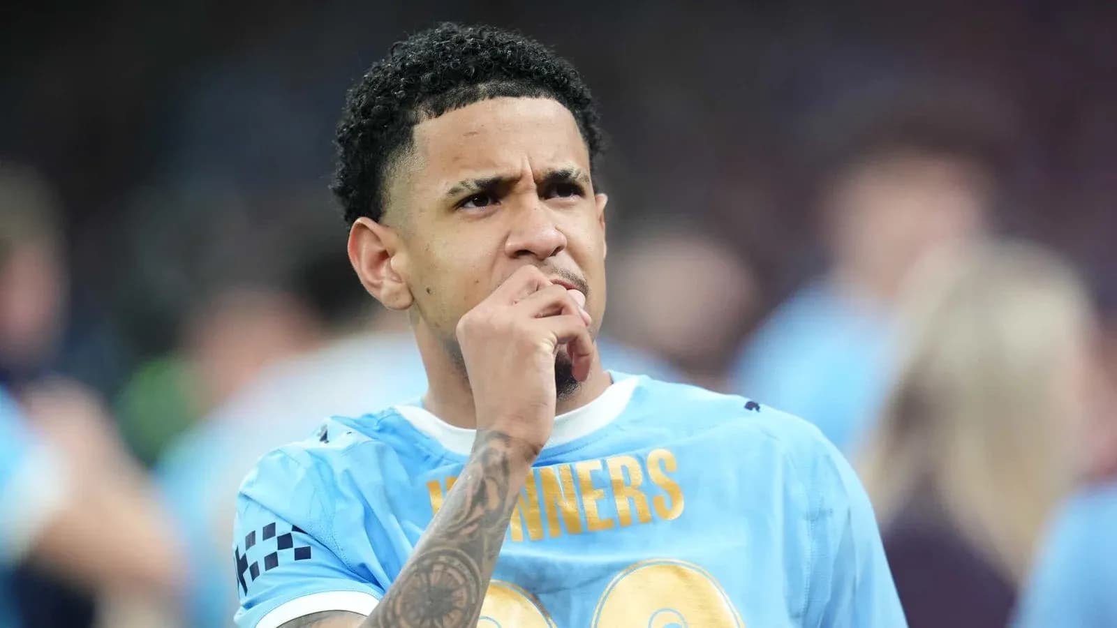 Player contemplating during match, wearing light blue jersey Player contemplating during match, wearing light blue jersey