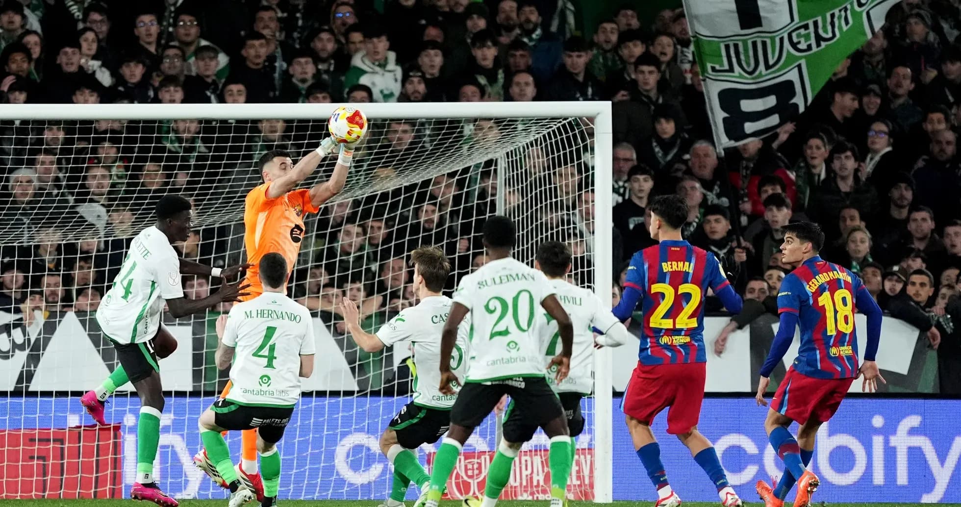 Goalkeeper catching the ball during a match Goalkeeper catching the ball during a match