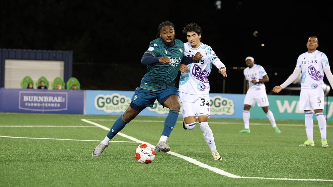 Pacific FC player dribbling against York United Pacific FC player dribbling against York United