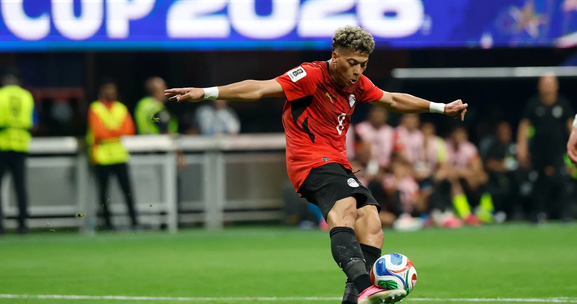 Player kicking a soccer ball during match Player kicking a soccer ball during match