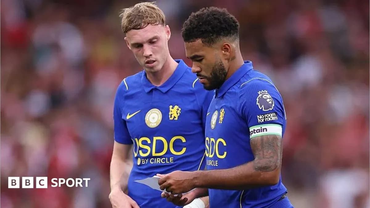 Chelsea players discussing strategy during a match Chelsea players discussing strategy during a match