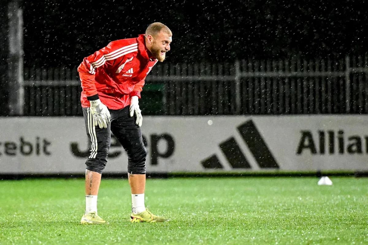 Goalkeeper training in rain on the pitch Goalkeeper training in rain on the pitch