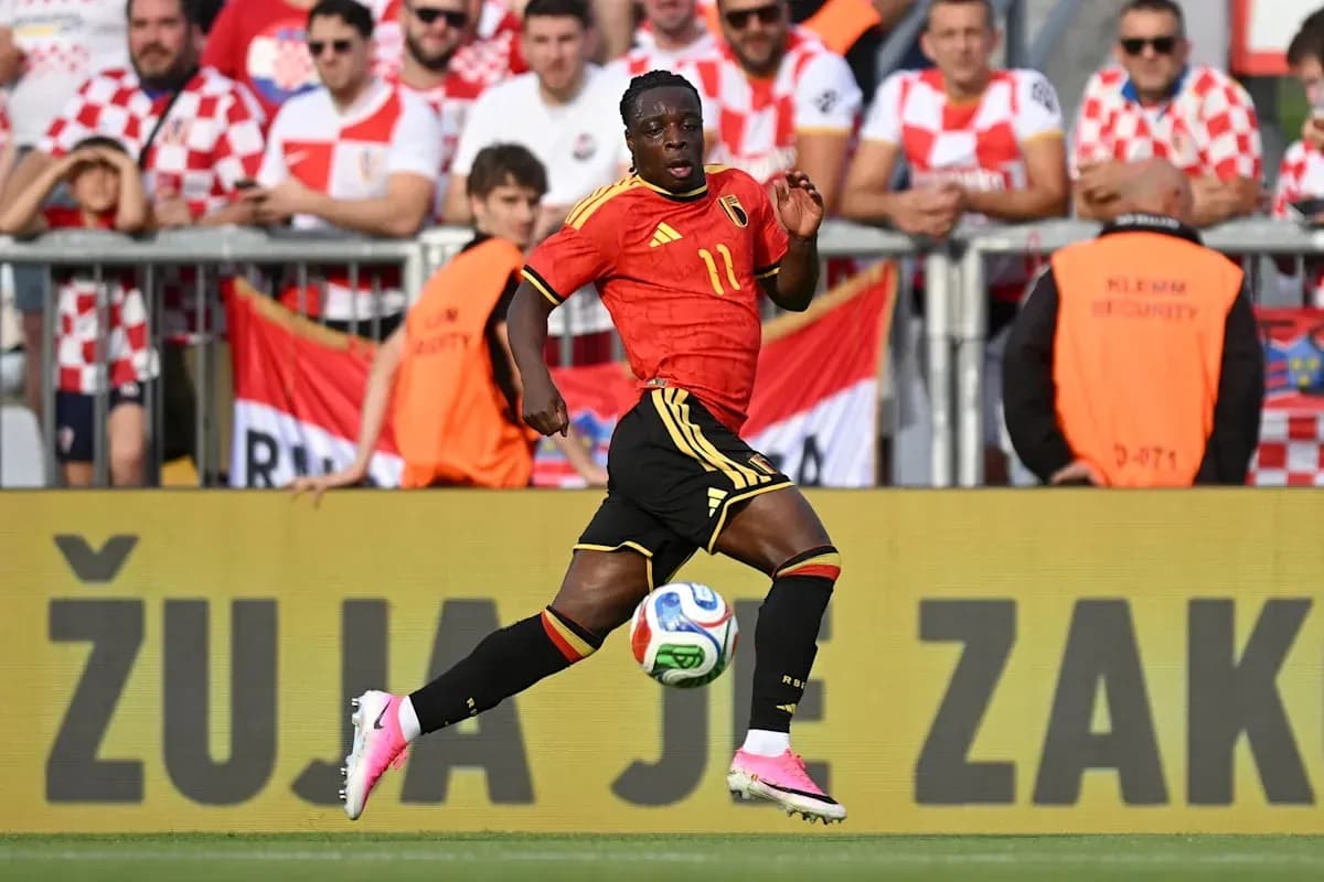 Belgium player running with ball during match Belgium player running with ball during match