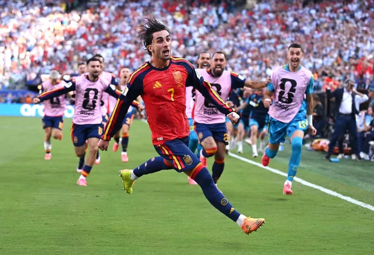Spain player celebrating a goal with teammates Spain player celebrating a goal with teammates