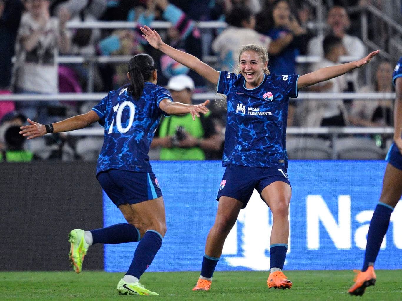 Players celebrating a goal during NWSL match Players celebrating a goal during NWSL match