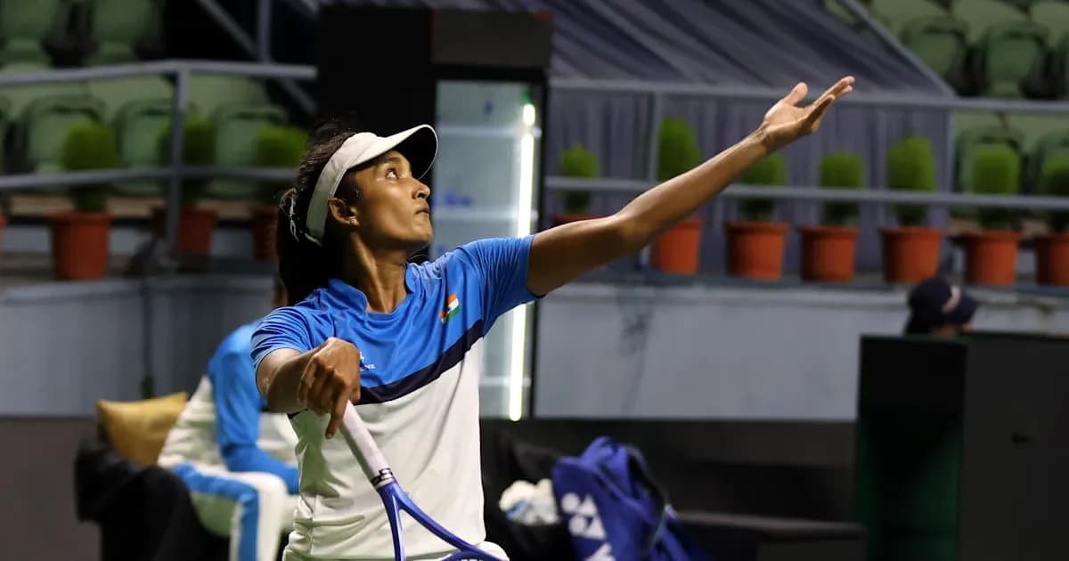 Female tennis player serving during practice session Female tennis player serving during practice session
