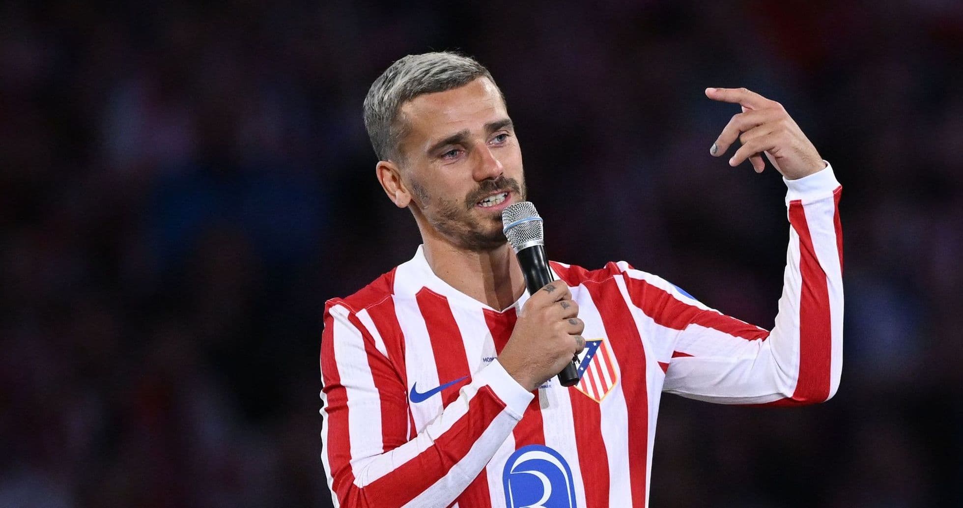 Player speaking into microphone at event Player speaking into microphone at event