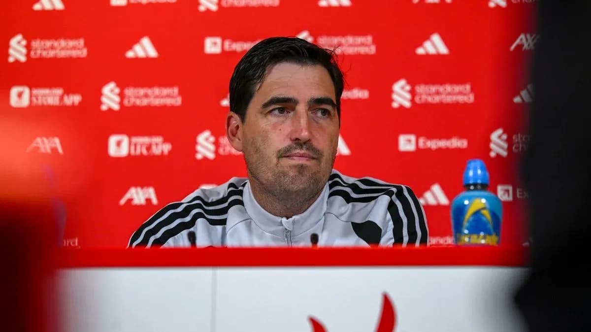 Manager speaking at press conference with backdrop Manager speaking at press conference with backdrop