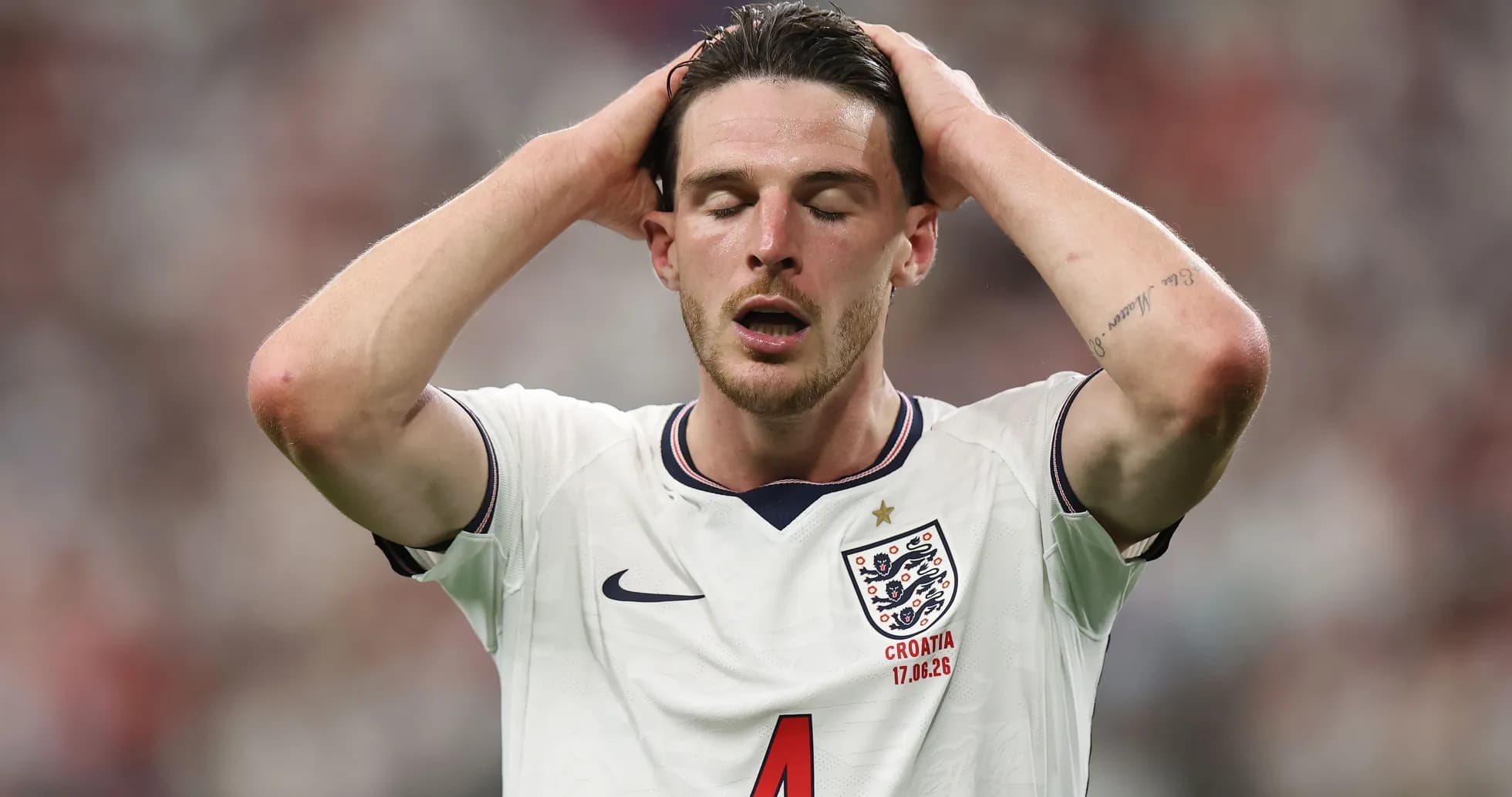 Player holding head in frustration during match Player holding head in frustration during match