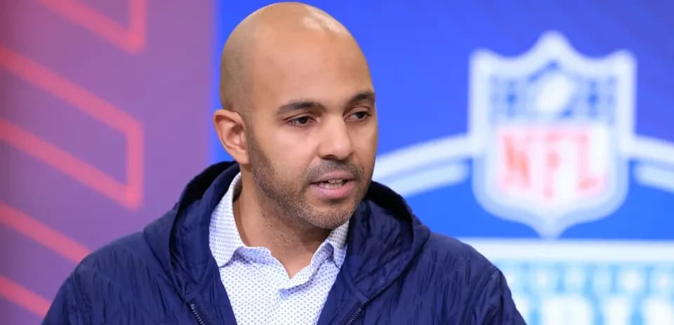 Speaker at NFL event discussing player prospects Speaker at NFL event discussing player prospects