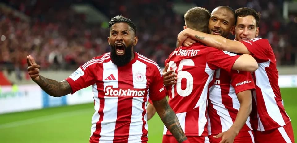 Olympiakos players celebrating a goal Olympiakos players celebrating a goal