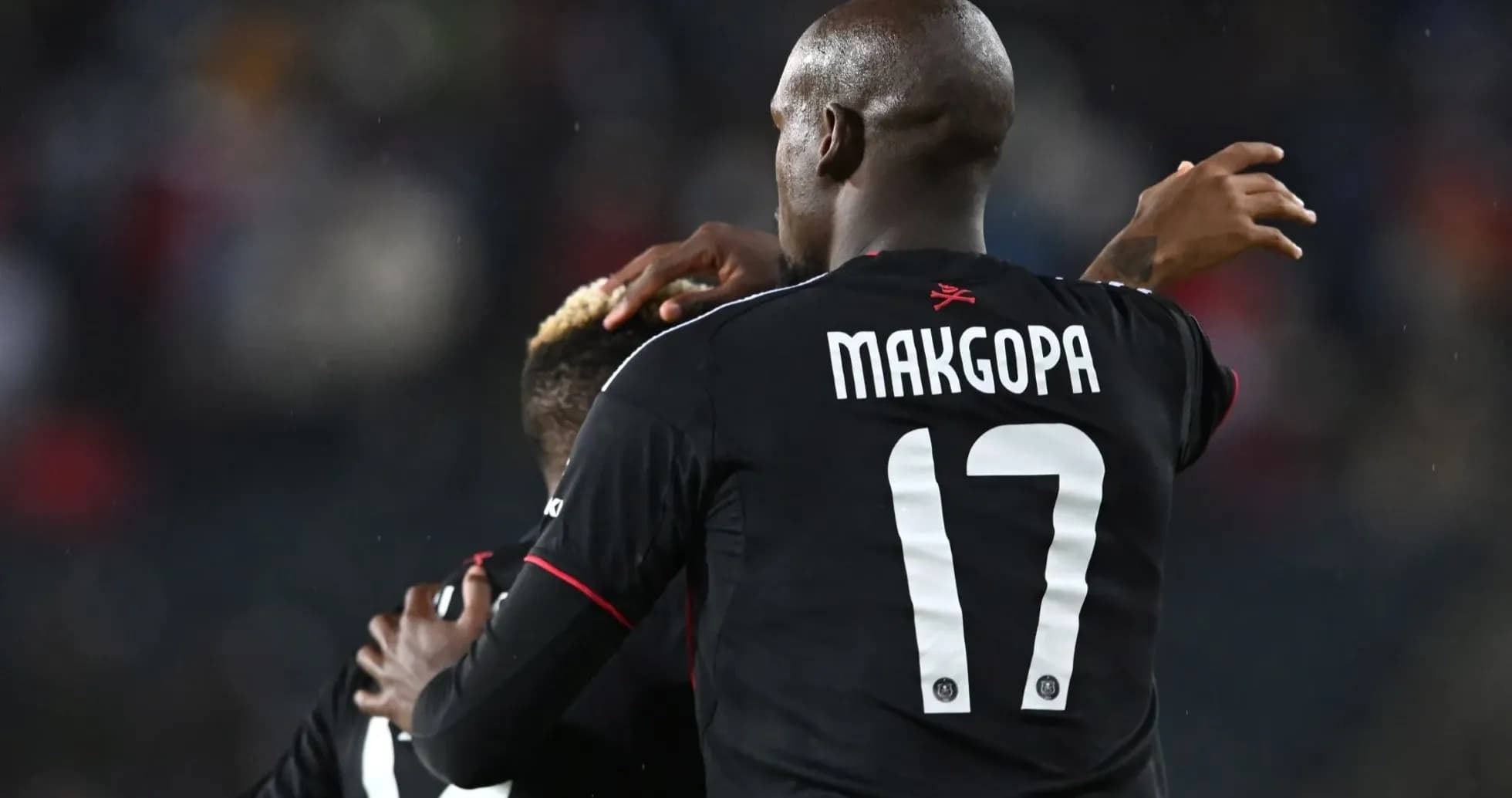 Players celebrating during a football match Players celebrating during a football match