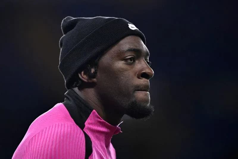 Athlete wearing pink training gear and black beanie Athlete wearing pink training gear and black beanie
