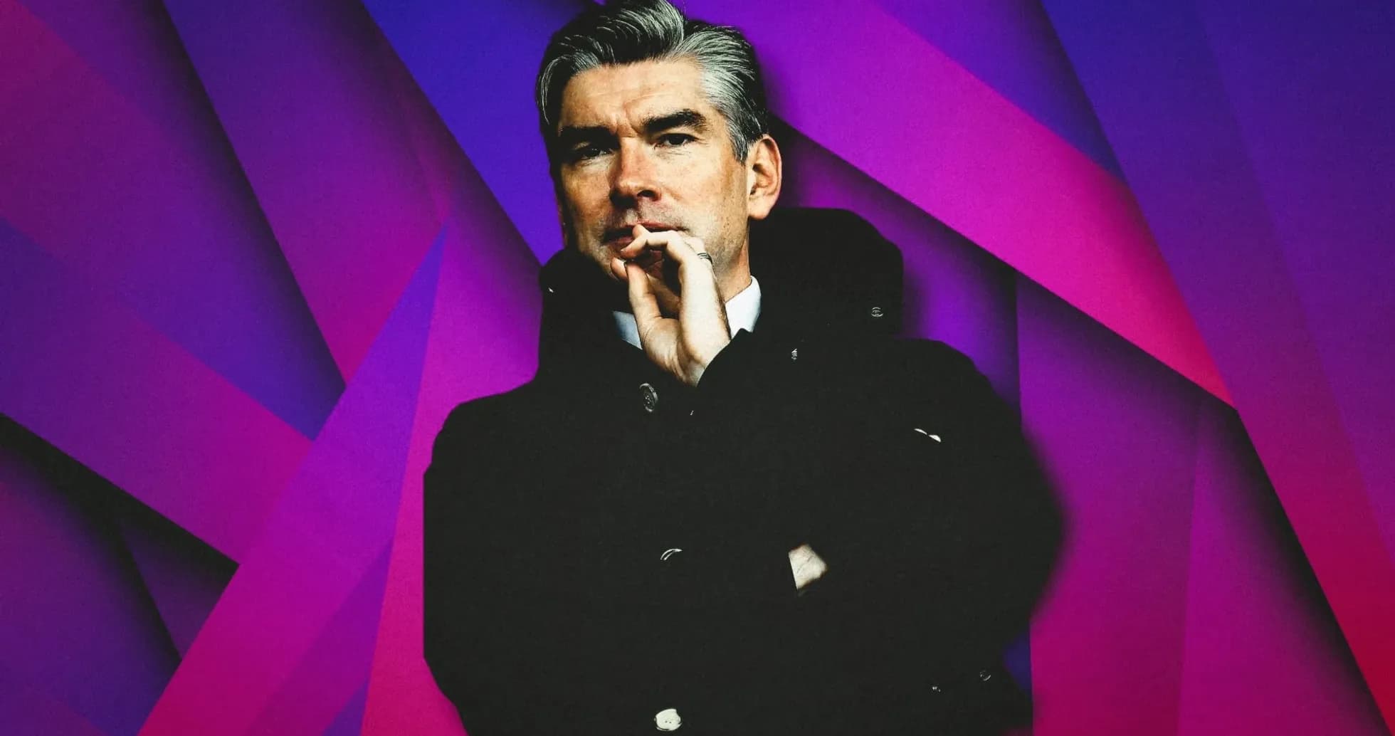 Man in a black coat with a thoughtful expression Man in a black coat with a thoughtful expression