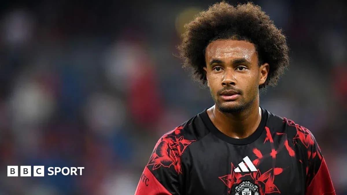 Player wearing Manchester United jersey on the pitch Player wearing Manchester United jersey on the pitch