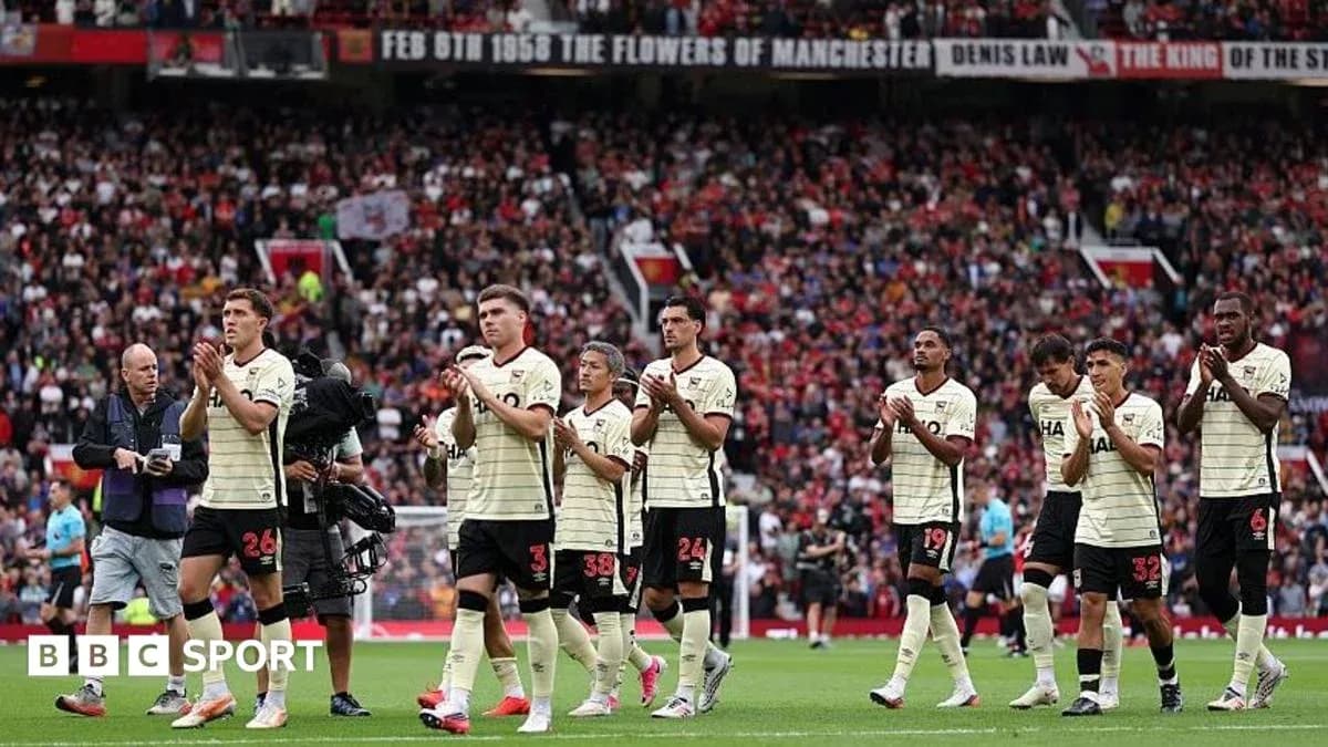 Players applauding fans at Old Trafford stadium Players applauding fans at Old Trafford stadium