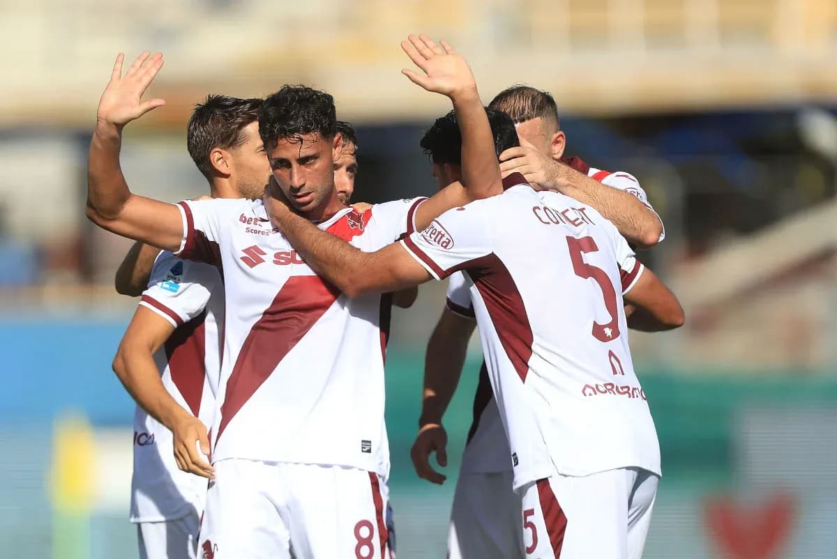 Players celebrating a goal during a match Players celebrating a goal during a match