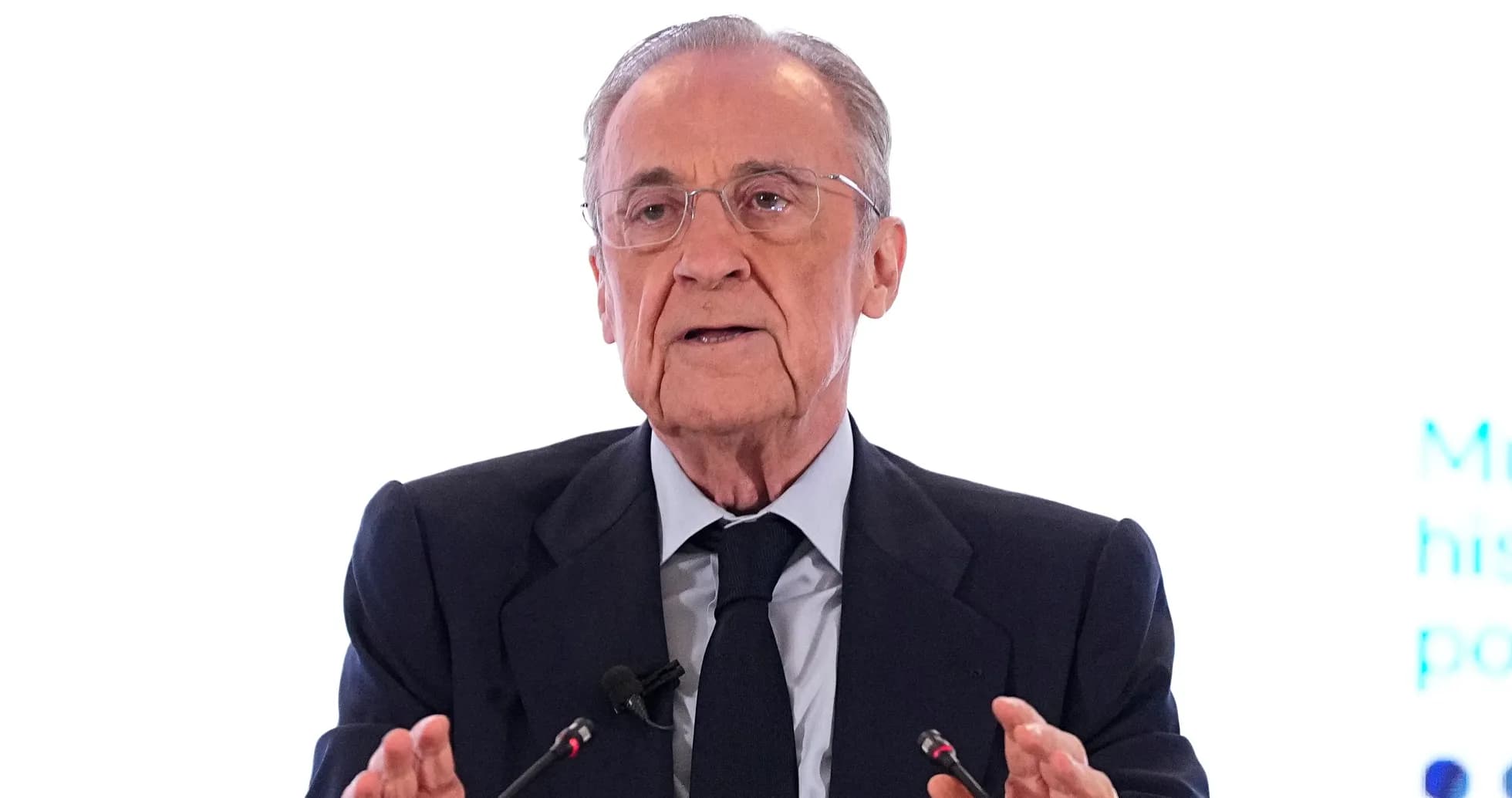 Man speaking at podium during a conference Man speaking at podium during a conference
