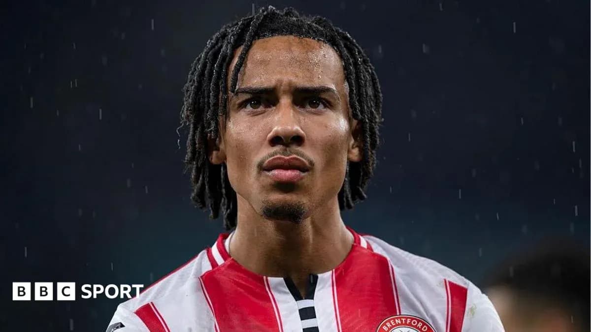 Brentford player looking serious in rain Brentford player looking serious in rain