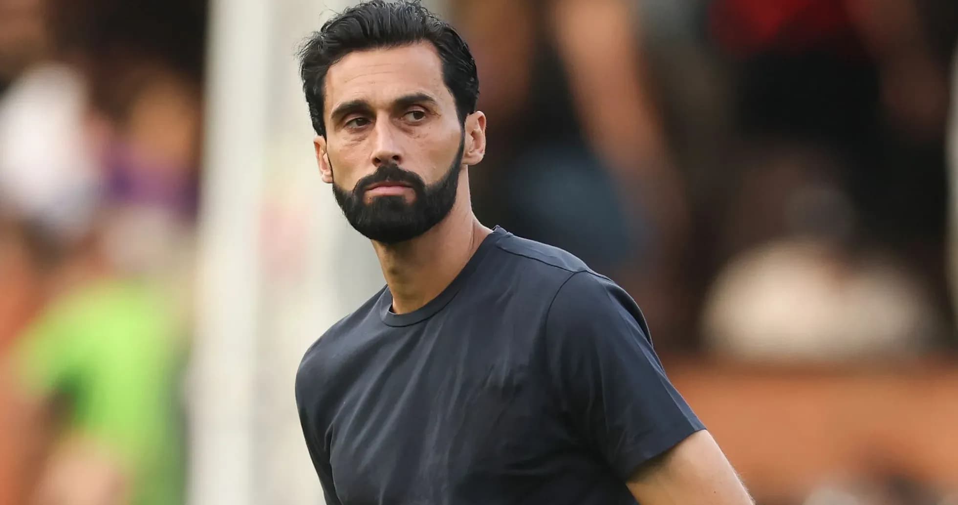Player in black shirt observing the match Player in black shirt observing the match