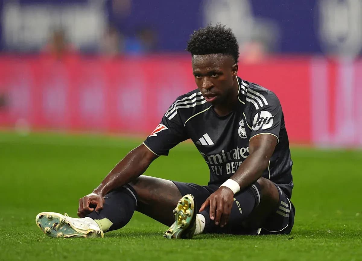 Player sitting on the pitch during a match Player sitting on the pitch during a match