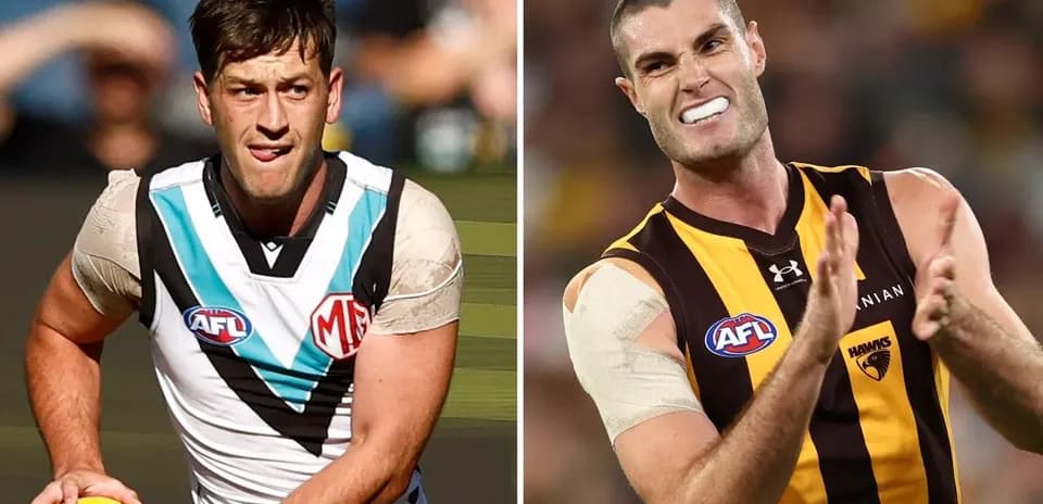 Two AFL players in action during a match Two AFL players in action during a match