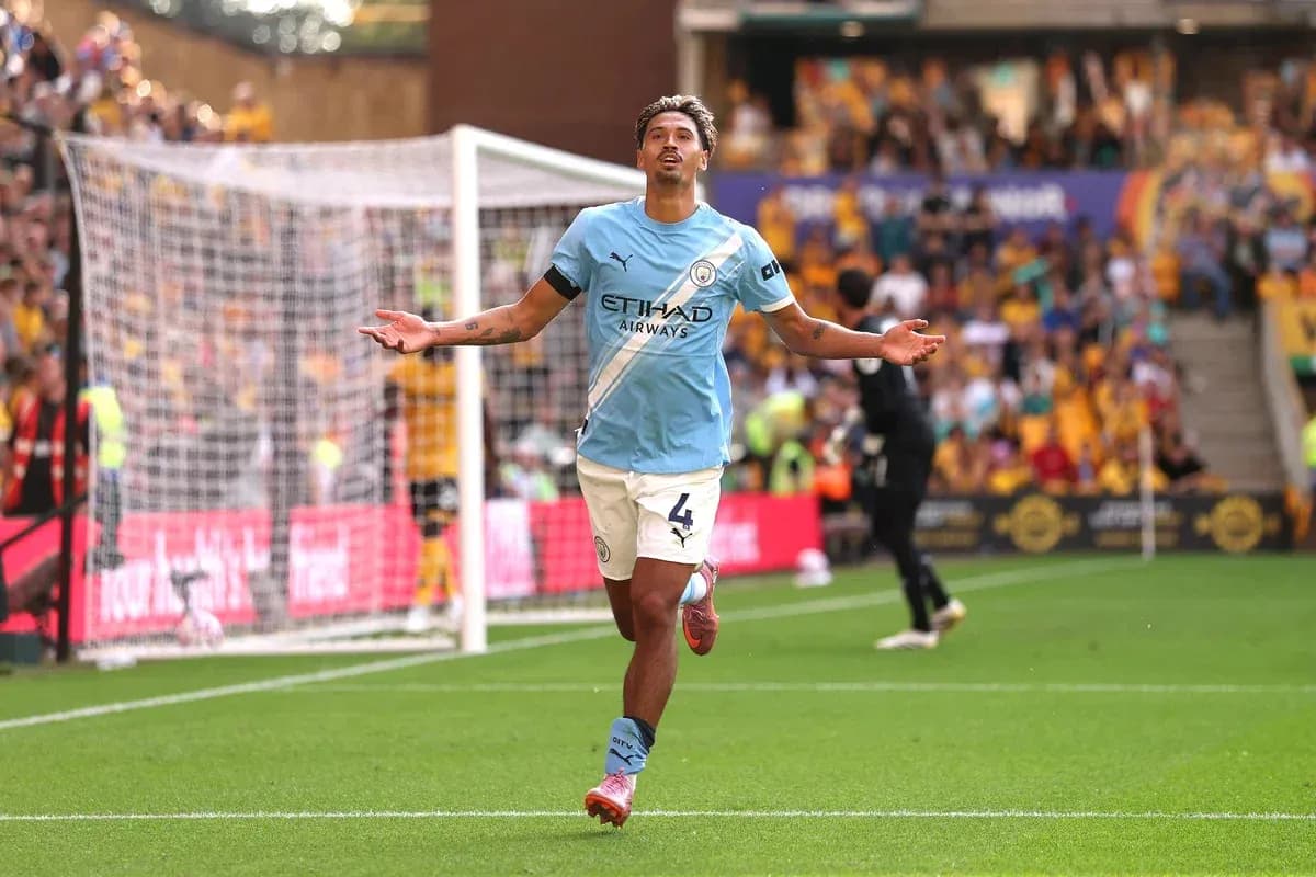 Player celebrating after scoring a goal for Manchester City Player celebrating after scoring a goal for Manchester City