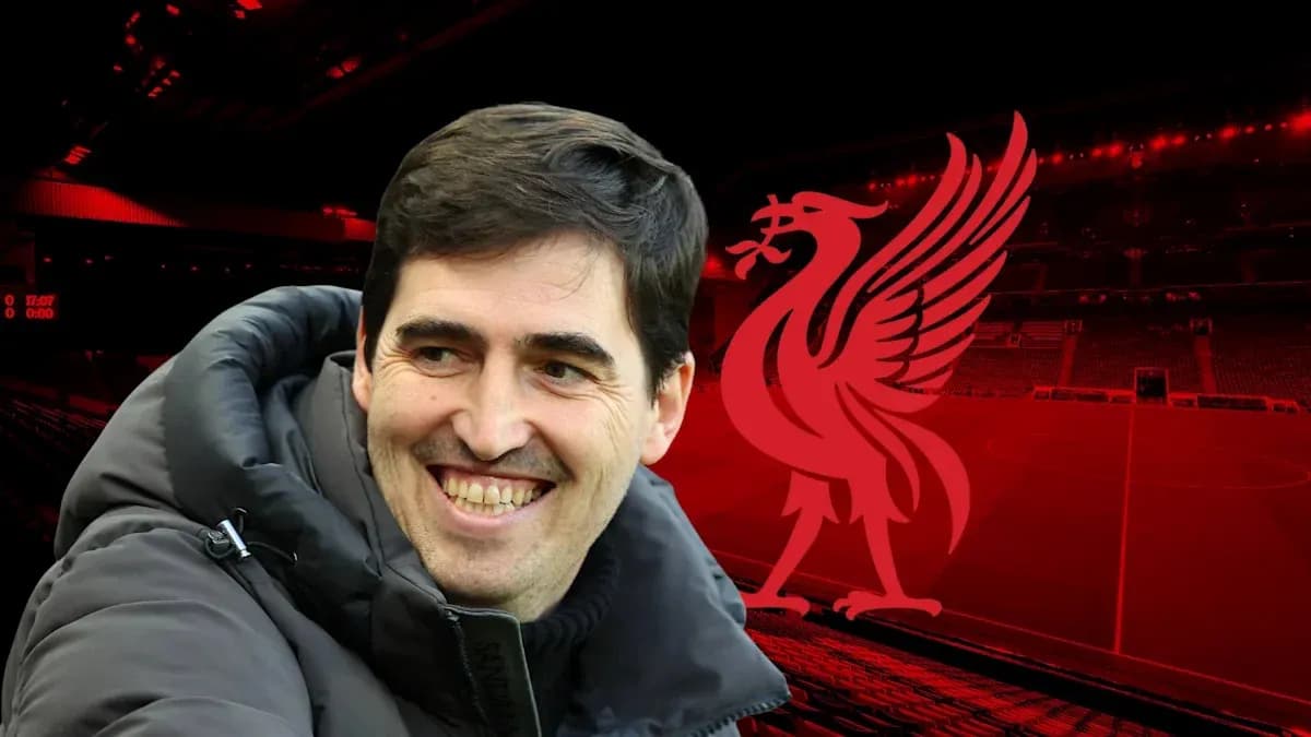 Coach smiling in front of Liverpool stadium backdrop Coach smiling in front of Liverpool stadium backdrop