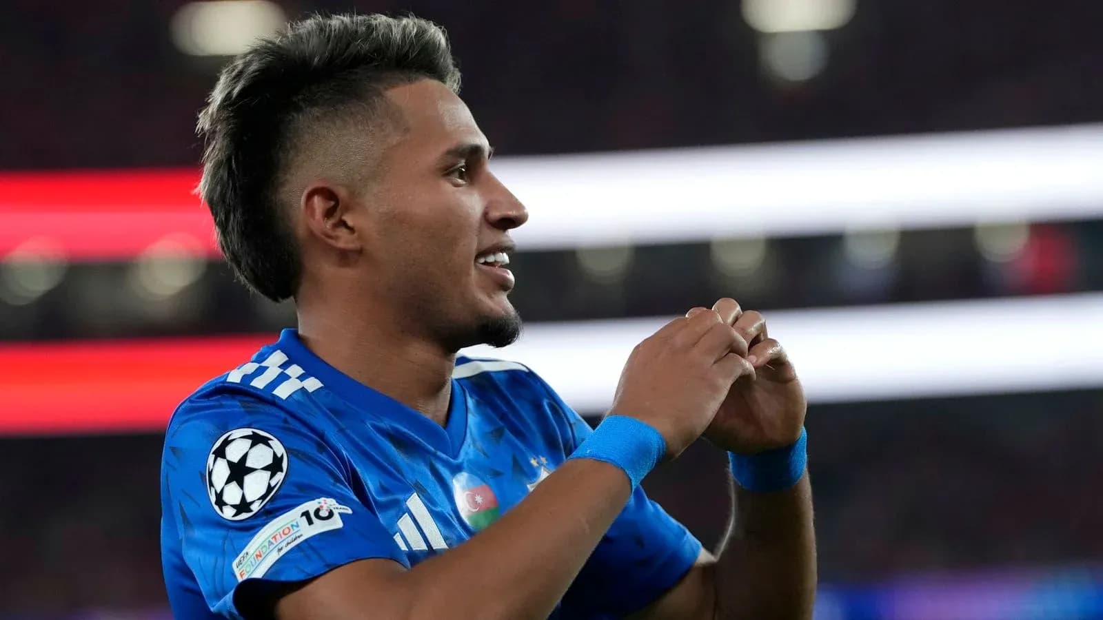 Player celebrating after scoring during a match Player celebrating after scoring during a match