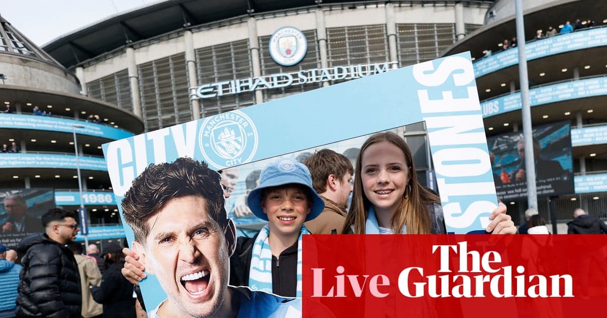 Fans holding a sign outside Etihad Stadium Fans holding a sign outside Etihad Stadium