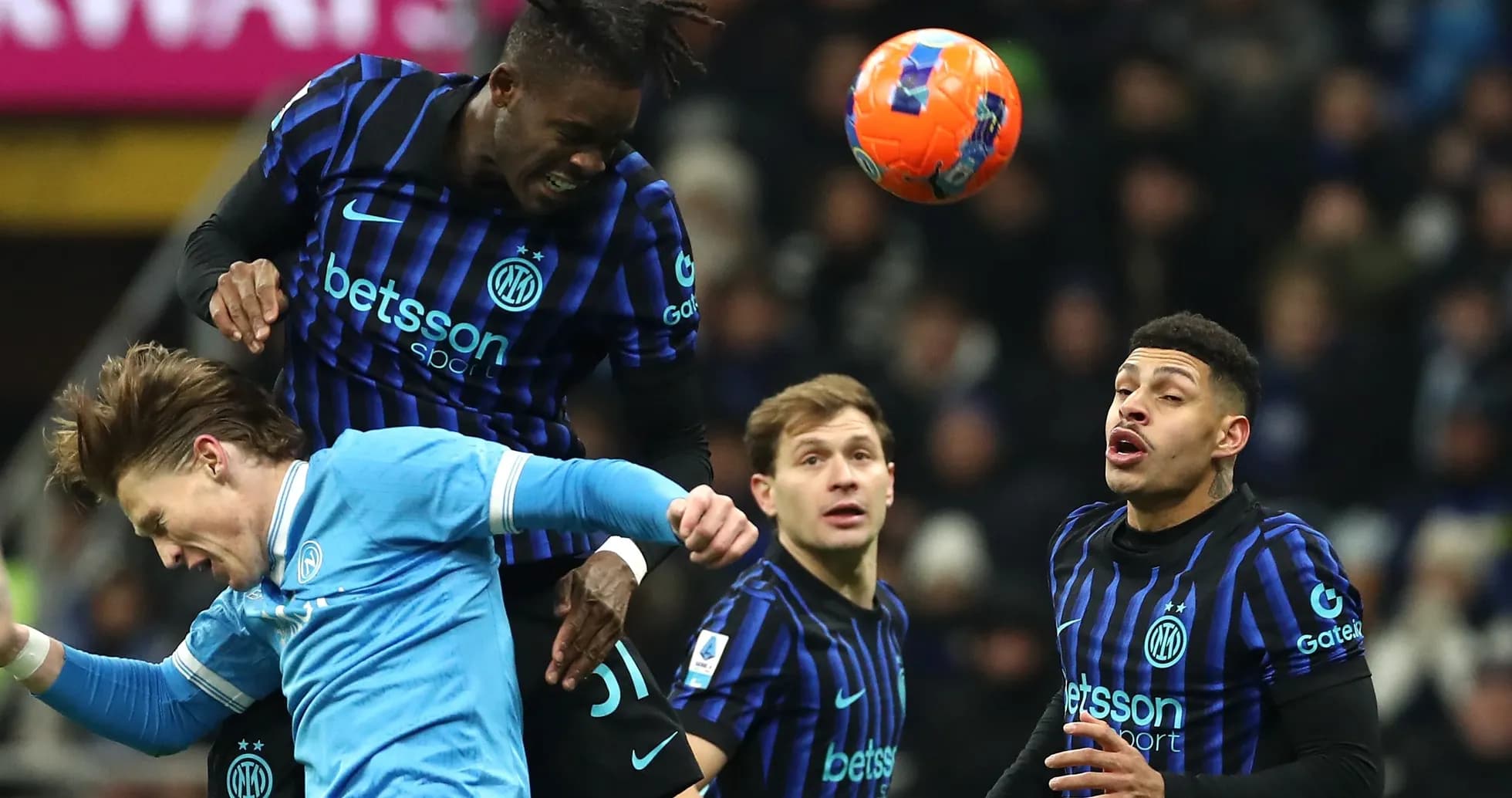 Players contesting for the ball during a match Players contesting for the ball during a match