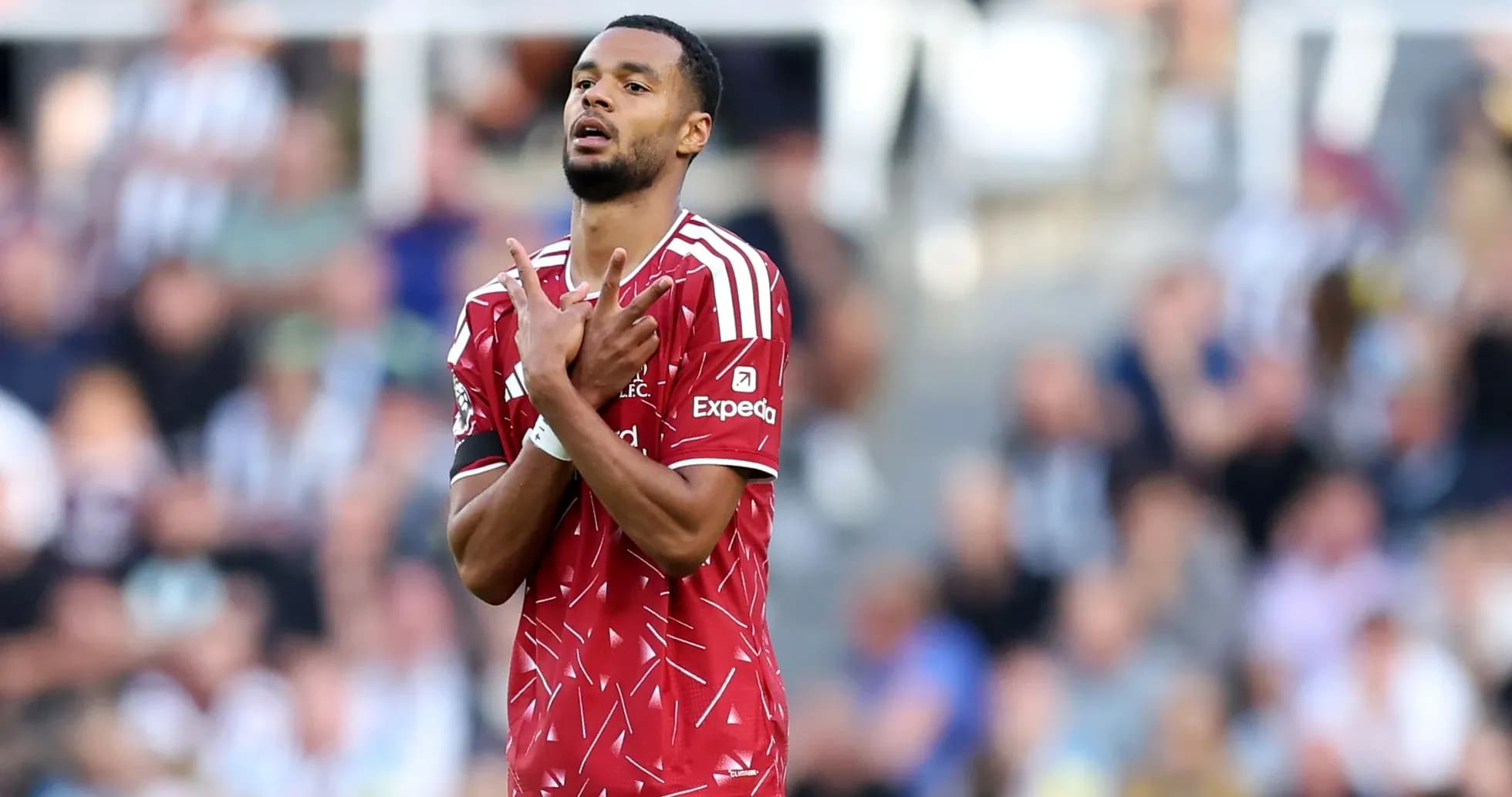Player in red jersey gesturing during match Player in red jersey gesturing during match