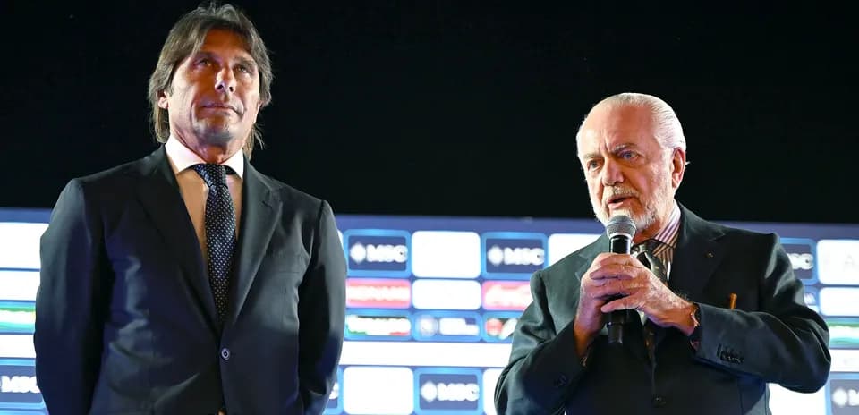 Two men at podium during press event Two men at podium during press event