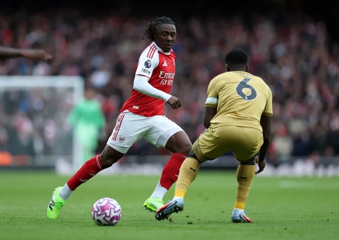 Arsenal player dribbling past Crystal Palace defender Arsenal player dribbling past Crystal Palace defender