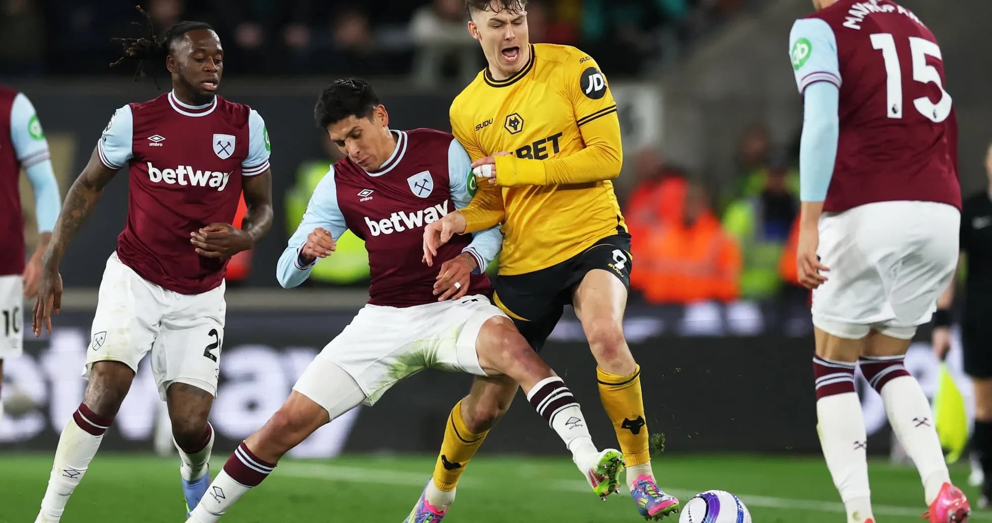 West Ham players challenging Wolves attacker during match West Ham players challenging Wolves attacker during match