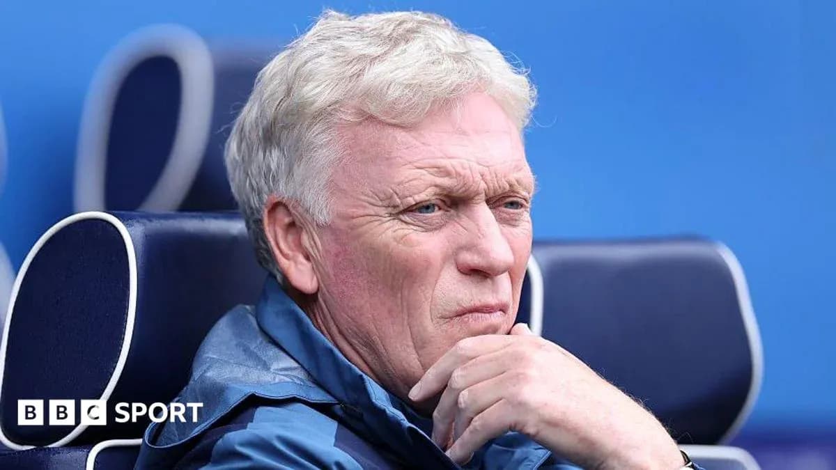 Manager seated on bench during match Manager seated on bench during match