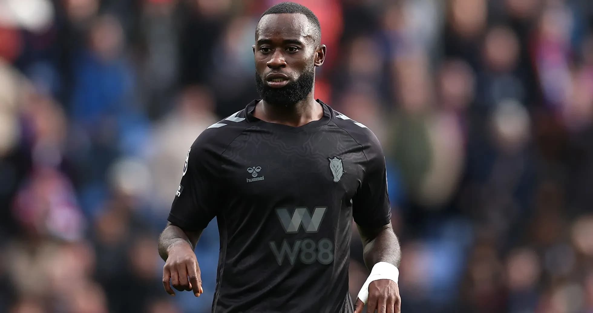 Player in black jersey during match on field Player in black jersey during match on field