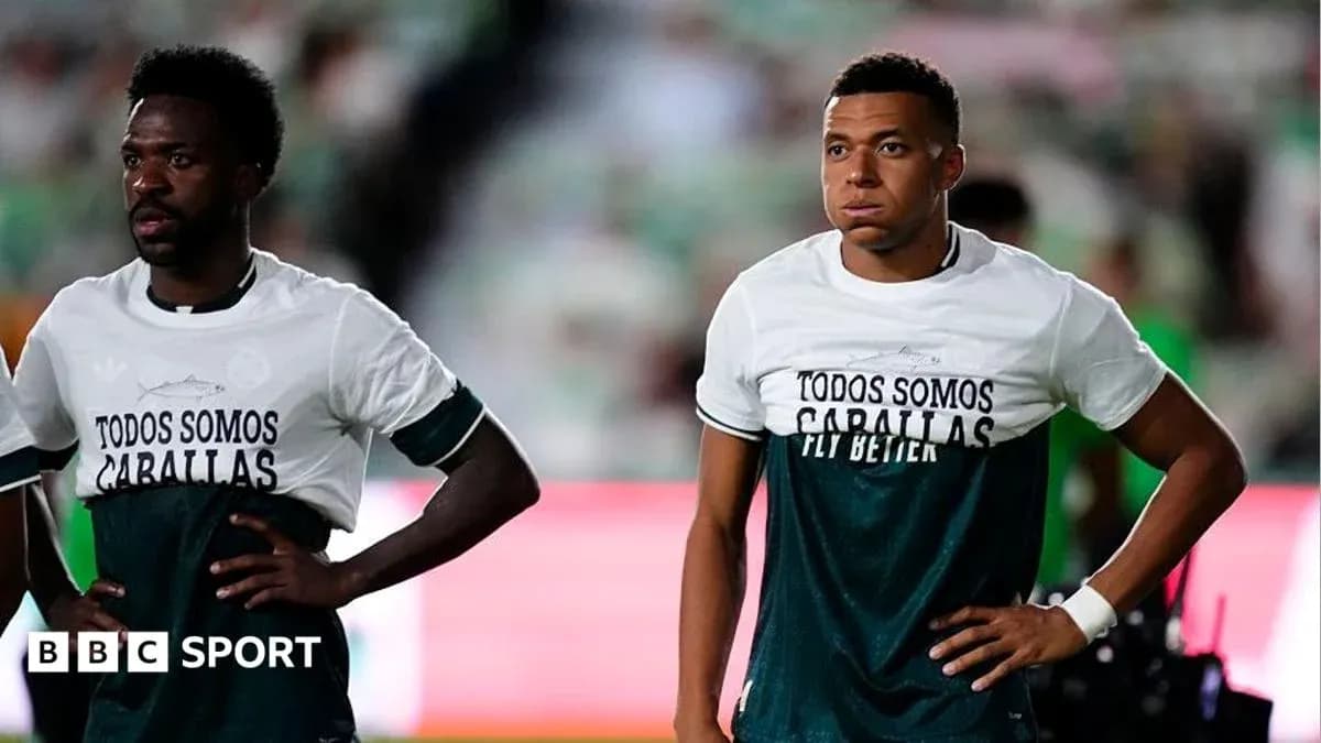 Two players wearing warm-up shirts on the field Two players wearing warm-up shirts on the field
