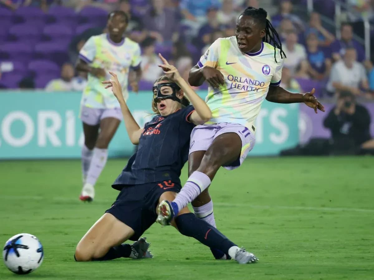 Player tackling during Orlando Pride vs Bay FC match Player tackling during Orlando Pride vs Bay FC match